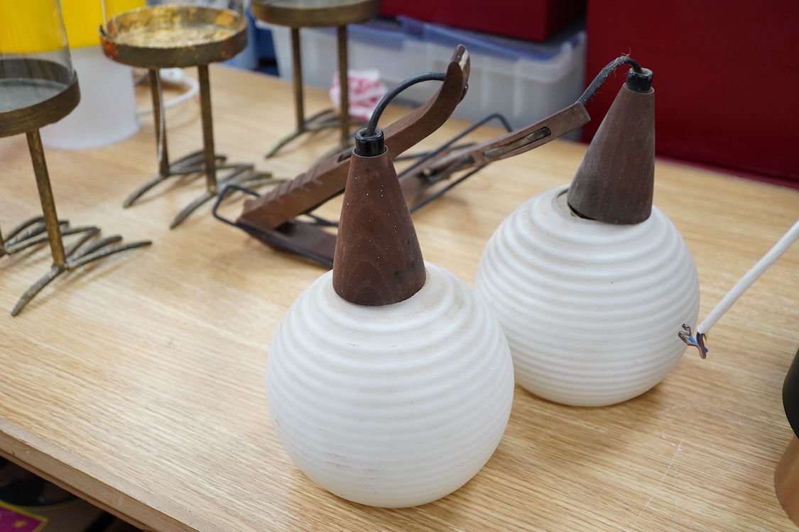 A pair of 1960s teak and opaque glass adjustable light fittings